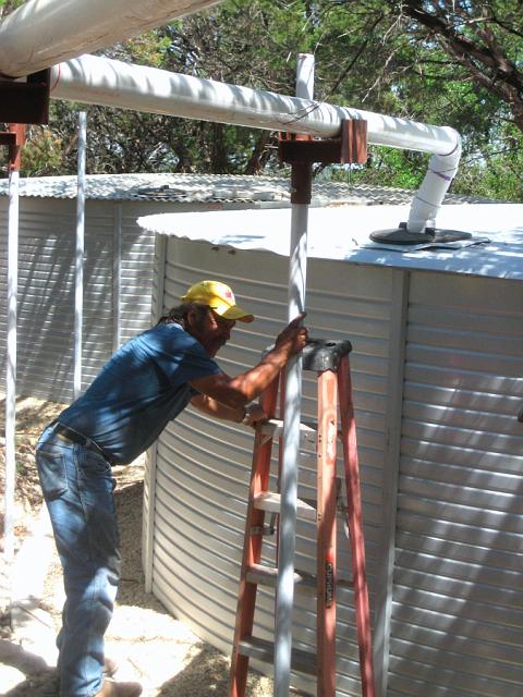 Aqueduct4.JPG - Attaching aqueduct pipe to tank inlet. April 11, 2008.