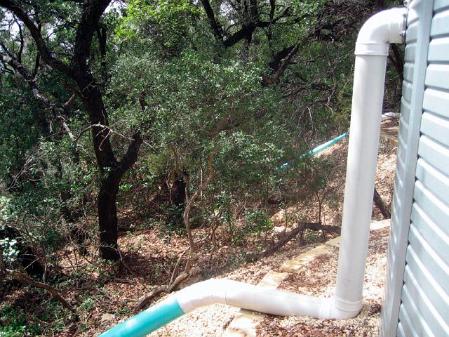 Overflow2.JPG - Overflow pipe extensions.  Added to prevent erosion of tank pad underlayment.  September 12, 2008.