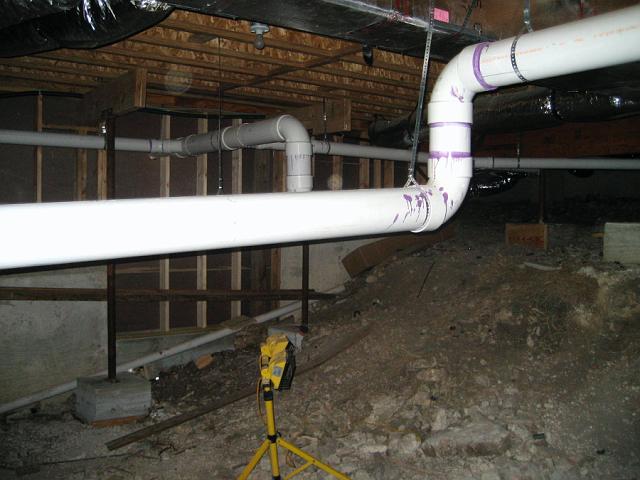 RainPipe5.JPG - Horizontal rainwater collection pipes seen from crawl space side. February 22, 2008.