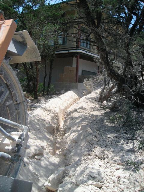 WaterTrench.JPG - Trench for water supply line leading from pump house through crawl space to garage. June 18, 2008.