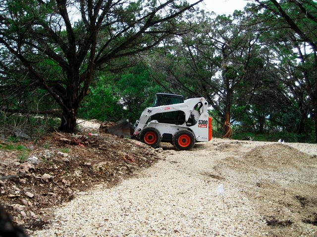 Expansion1.JPG - Bobcat leveling tank area with underlayment gravel. May 23, 2007.