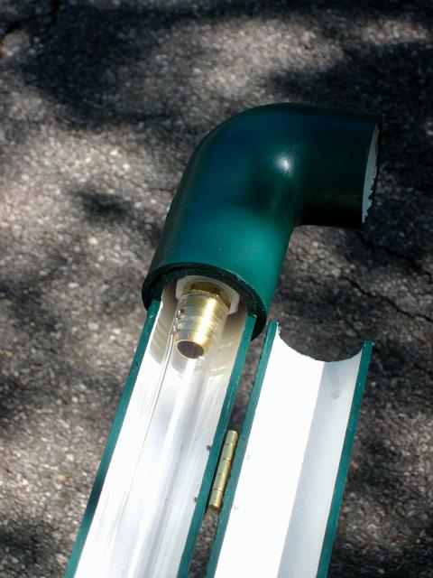 TankGauge2.JPG - Top end of tank level gauge, front side, hinged cover open, clear tubing visible. Ell will be connected to tank overflow pipe. May 2, 2008.