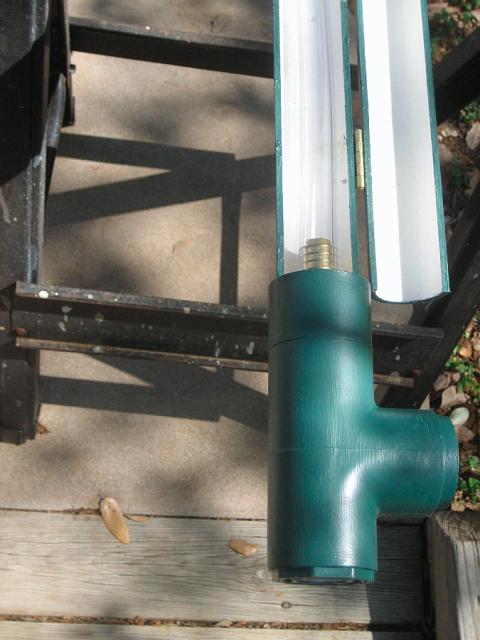 TankGauge3.JPG - Bottom end of tank level gauge, front side, hinged cover open, clear tubing visible. Pipe from tank will be connected to bottom of tee, drain valve to side of tee. May 2, 2008.